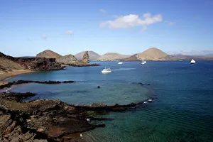 View of coastline and incoming boats from Bartolome Island, Galapagos Islands View of coastline and incoming boats from Bartolome Island, Galapagos Islands
