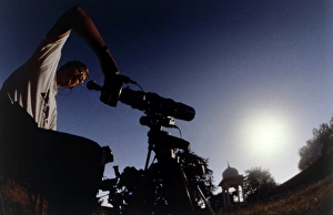 Amateur astronomer observing a solar eclipse Amateur astronomer observing a solar eclipse