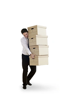 Prints of MODEL RELEASED. Carrying boxes. Office worker carrying too may boxes Images Dated 2012 November: Carrying boxes Print