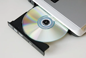 Electronic Data Storage Prints: CD drive on a laptop computer