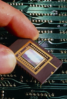A charged CCD infront of printed circuit board A charged CCD infront of printed circuit board