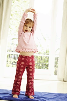 Young Girl Exercising Prints: Childhood exercise