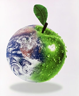 Computer artwork of half Earth and half apple Computer artwork of half Earth and half apple