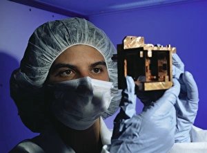 Prints of Dark matter detector. Technician Cristina Cozzini of the Gran Sasso Laboratory holding a sapphire crystal encased in copper Images Dated 2003 June: Dark Matter Detector Print