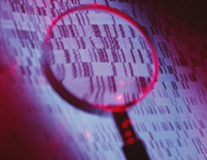 DNA sequence magnified by a magnifying glass DNA sequence magnified by a magnifying glass