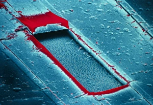 False-col SEM of cracked surface of compact disc False-col SEM of cracked surface of compact disc