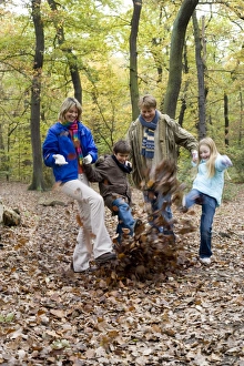 Family playing in a wood Family playing in a wood