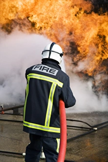 Protective Clothing Equipment Prints: Firefighter extinguishing a fire