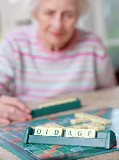 Images Dated 25th September 2006: Geriatric care Print: 83 year old woman playing Scrabble