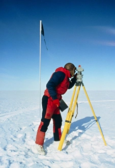 Glaciologist using theodolite on Ronne Ice Shelf Glaciologist using theodolite on Ronne Ice Shelf