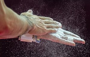 Gymnast applying rosin to hands C015/5897 Gymnast applying rosin to hands C015/5897