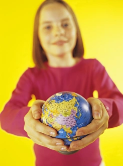 Child Holding Globe Prints: Holding a globe
