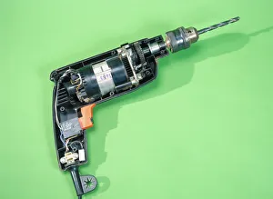 Prints of Electric drill opened to show its interior components Images Dated 2006 August: Electric Drill Internal Components Print