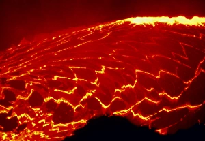 Lava lake covered with sections of cooled rock Lava lake covered with sections of cooled rock
