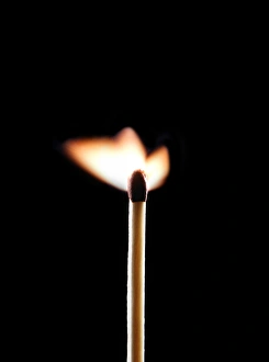 Glowing Ember Prints: Lit match