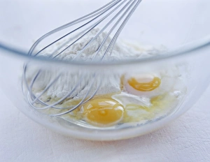 Prints of Making pasta by whisking together eggs and flour Images Dated 2004 August: Pasta Print: Whisked Egg and Flour Mixture