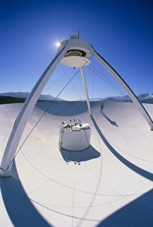 Man on a VLBA radio telescope, Owens Valley, USA Man on a VLBA radio telescope, Owens Valley, USA