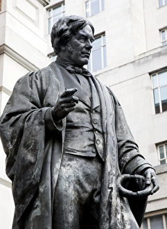 Michael Faraday Print, a bronze depiction in academic robes holding an induction ring