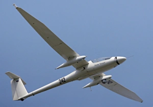 Prints of Motor glider. View of a Stimme S-10 motor glider during powered flight. A motor glider is a glider which has a small engine fitted that allows it to take-off unaided or extend its range Images Dated 2010 September: View of a Stimme S-10 motor glider during powered flight, Print
