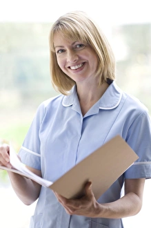 Science Photo Library Nurse Checking Notes Print