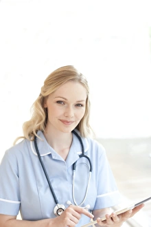 Healthcare Innovation Prints: Nurse using a tablet computer F008 / 3063