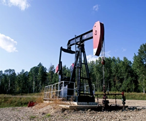 Prints of Oil pump at an oil well. This machine is commonly known as a nodding donkey or jack pump. It is used to draw crude oil from a well Images Dated 2009 May: Oil pump Print, a nodding donkey at an oil well in Lodgepole, Alberta