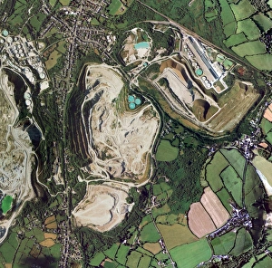 Prints of Open cast mine. Aerial photograph of Gunheath china clay pit. Kaolin (china clay) is a clay material used in a wide variety of ceramic applications Images Dated 2006 January: Open Cast Mine Print: Aerial View of Gunheath China Clay Pit
