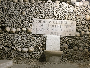 Prints of Paris Catacombs. The Catacombs of Paris (Catacombes de Paris) are an underground ossuary (final resting place of human skeletal remains) in Paris, France Images Dated 2012 October: Paris Catacombs Print