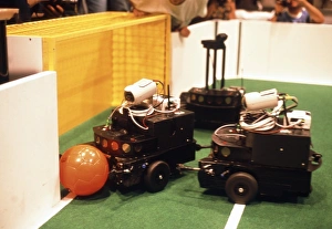Robots trying to score a goal at RoboCup-98, Paris Robots trying to score a goal at RoboCup-98, Paris