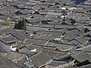 Prints of Rooftops in Lijiang old town, yunnan, China. The old town area of Lijiang city is an UNESCO World Heritage Site Images Dated 2007 March: Lijiang Old Town Rooftops Print