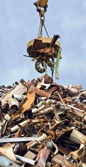 Prints of Electromagnet being used to lift ferrous metal (iron and steel) at a scrap yard. The magnetic properties of ferrous metal make it easy to separate from other waste Images Dated 2008 April: Scrap Metal Electromagnet Lift Print