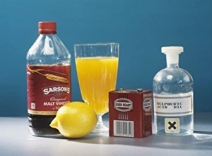 Prints of Selection of acids. Household products containing acids, alongside sulphuric acid. Malt vinegar, which is manufactured from the fermentation of malt products, contains ethanoic, or acetic, acid Images Dated 2004 November: Sulphuric Acid Print
