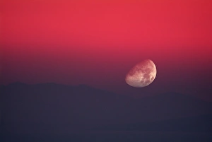 Red Sky At Sunset Prints: Setting Moon in a red sky