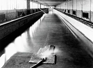 Prints of Ship testing tank, being filled with water from a hose pipe (bottom). This tank was used to test models of ships being developed by engineers Images Dated 2007 June: Ship Testing Tank Print