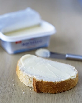 Kitchen Still Life Photos Prints: Slice of buttered bread