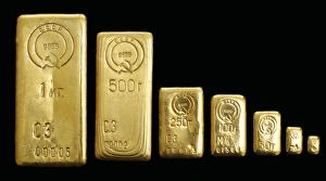 Prints of Soviet gold bars, stamped with their weight and the hammer-and-sickle symbol of the Soviet Union. The stamp of CCCP is the abbreviation for the Cyrillic form of USSR Images Dated 2011 February: Soviet Gold Bars Print