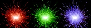 Prints of Sparklers burning to produce coloured flames. This type of hand-held firework consists of a thin metal rod that has been dipped into a pyrotechnic liquid and allowed to dry Images Dated 2005 April: Sparkler Print: Dried Pyrotechnic Rod with Coloured Flames