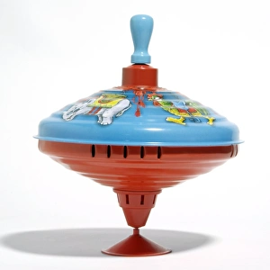 Prints of Spinning top. This toy plays music when spun by pulling the blue handle (top) up and then pushing it back down to its starting position Images Dated 2008 November: Spinning Top Print
