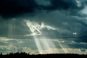 Suns rays breaking through clouds Suns rays breaking through clouds