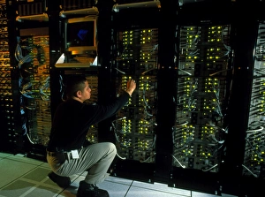 Technician monitoring supercomputers at Celera Technician monitoring supercomputers at Celera
