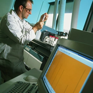 Chemistry Laboratory Equipment Prints: Technician prepares samples for mass spectrometer