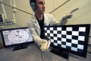 Technician testing TV monitors C018/2336 Technician testing TV monitors C018/2336