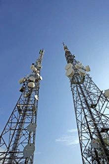 Prints of Telecommunications masts. The dishes and antennas on these masts receive, amplify and relay mobile phone, microwave and radio signals. Photographed in Curno, Italy Images Dated 2007 November: Telecommunications Mast Print, Italy