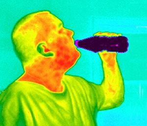 Thermography Images Prints: Thermogram of a man drinking from a bottle
