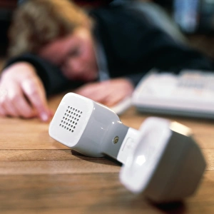 Unconscious woman lying near a telephone Unconscious woman lying near a telephone