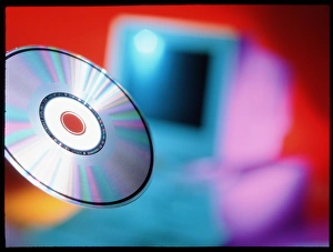 Compact Disc Storage Prints: View of CD-ROM disc in front of personal computer