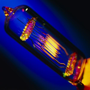 View of a lit technical electric light bulb View of a lit technical electric light bulb