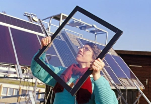 Woman holding an Interpane thermotrope window Woman holding an Interpane thermotrope window