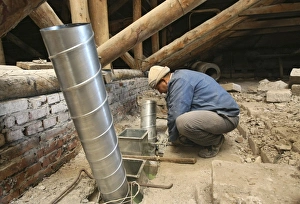 Building Renovation Prints: Worker installing ventilation