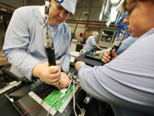 Workers assembling TV monitors C018/2333 Workers assembling TV monitors C018/2333
